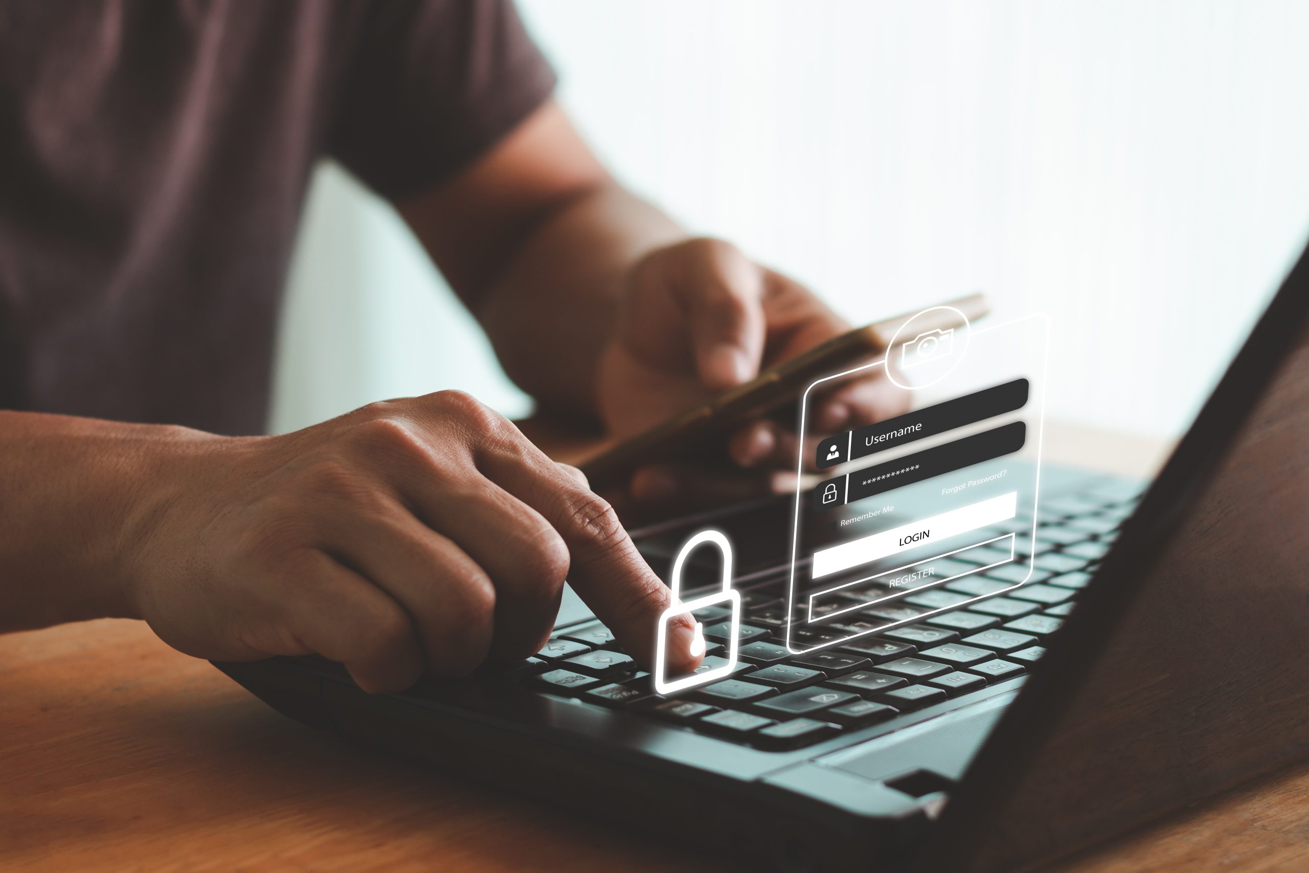 man achter laptop met inlogicoontjes